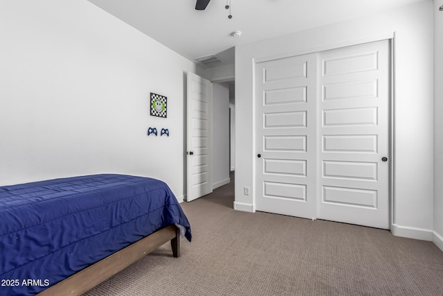 carpeted bedroom featuring a closet, visible vents, ceiling fan, and baseboards