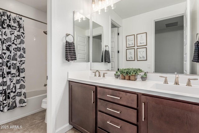 bathroom with shower / bath combo with shower curtain, a sink, toilet, and double vanity