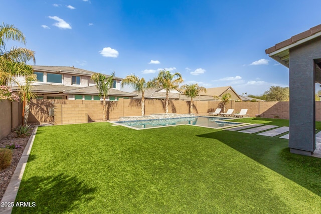 view of yard featuring a patio area, a fenced backyard, and a fenced in pool