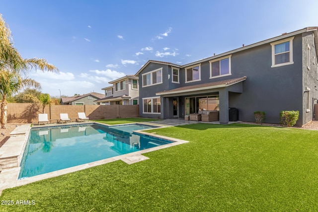 view of swimming pool featuring a lawn, a patio area, a fenced backyard, and a fenced in pool