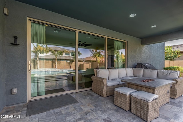 view of patio with a fenced in pool, an outdoor living space with a fire pit, fence, and area for grilling