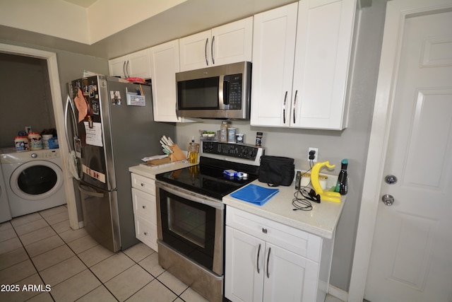 kitchen featuring washer / clothes dryer, stainless steel appliances, white cabinets, light tile patterned flooring, and light countertops