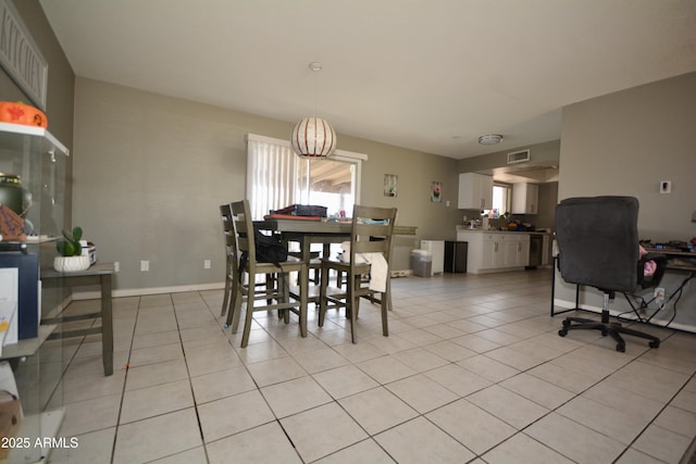 dining room with light tile patterned flooring, baseboards, and visible vents