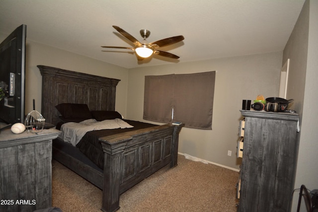 bedroom featuring a ceiling fan, carpet, and baseboards