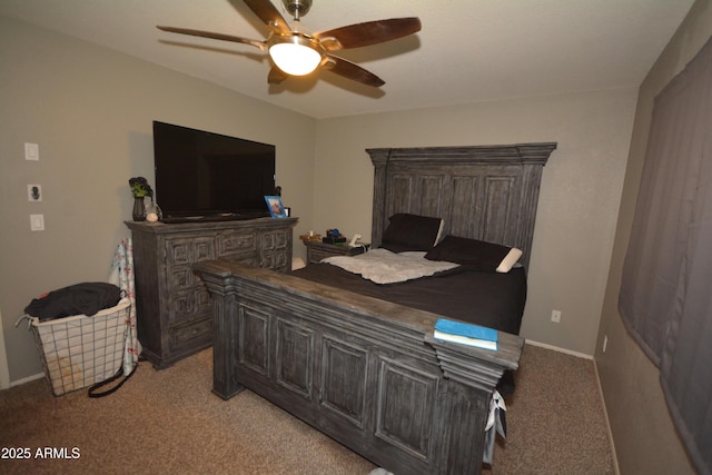 bedroom with light colored carpet, baseboards, and a ceiling fan