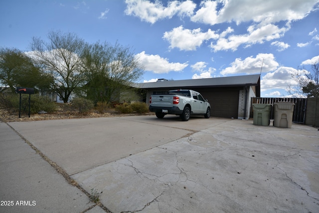 view of front of home with driveway and a garage