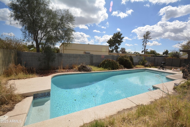 view of pool featuring a patio area, a fenced backyard, and a fenced in pool