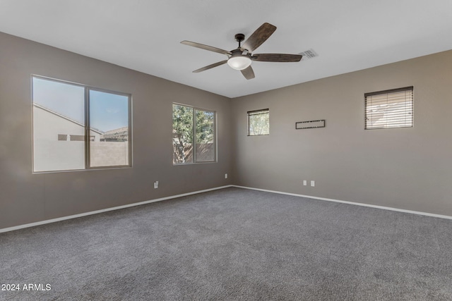 spare room with carpet flooring and ceiling fan