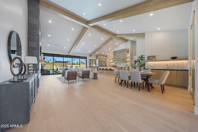 6126 E Charter Oak Rd, Scottsdale, AZ 85254 - living room featuring beamed ceiling, light wood-type flooring, recessed lighting, and high vaulted ceiling