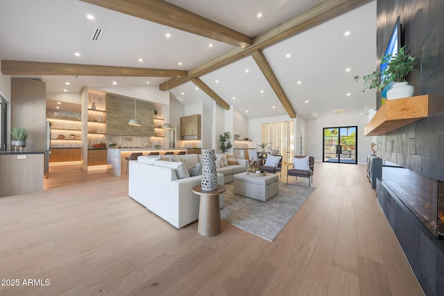 6126 E Charter Oak Rd, Scottsdale, AZ 85254 - living area featuring beam ceiling, light wood finished floors, high vaulted ceiling, and recessed lighting