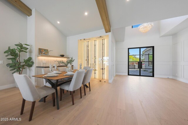 6126 E Charter Oak Rd, Scottsdale, AZ 85254 - dining area featuring high vaulted ceiling, a decorative wall, light wood-style floors, beamed ceiling, and a chandelier