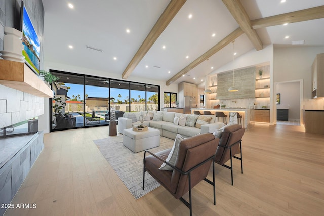 6126 E Charter Oak Rd, Scottsdale, AZ 85254 - living room featuring beamed ceiling, light wood-style flooring, high vaulted ceiling, and recessed lighting