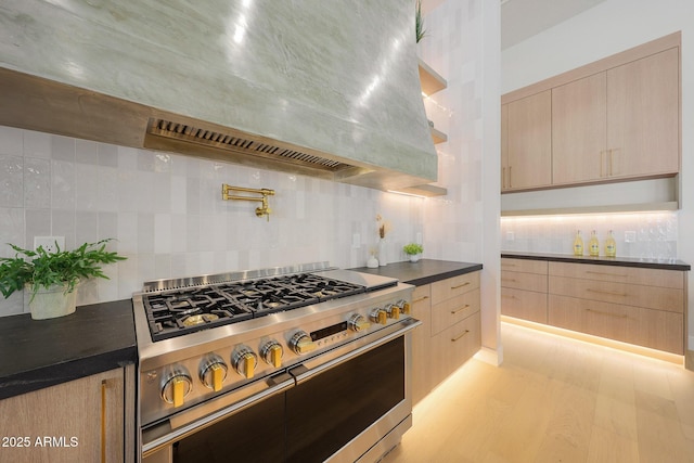 6126 E Charter Oak Rd, Scottsdale, AZ 85254 - kitchen with high end stainless steel range oven, light brown cabinetry, and modern cabinets