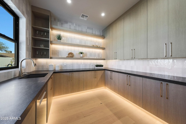 6126 E Charter Oak Rd, Scottsdale, AZ 85254 - kitchen with open shelves, backsplash, dark countertops, dishwasher, and recessed lighting