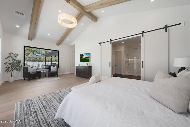 6126 E Charter Oak Rd, Scottsdale, AZ 85254 - bedroom featuring a barn door, wood finished floors, beam ceiling, recessed lighting, and high vaulted ceiling