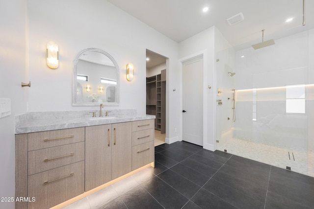 6126 E Charter Oak Rd, Scottsdale, AZ 85254 - full bathroom featuring walk in shower, a walk in closet, vanity, tile patterned flooring, and recessed lighting