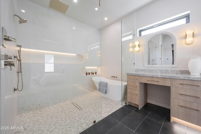 6126 E Charter Oak Rd, Scottsdale, AZ 85254 - bathroom with walk in shower, vanity, a freestanding bath, tile patterned floors, and recessed lighting