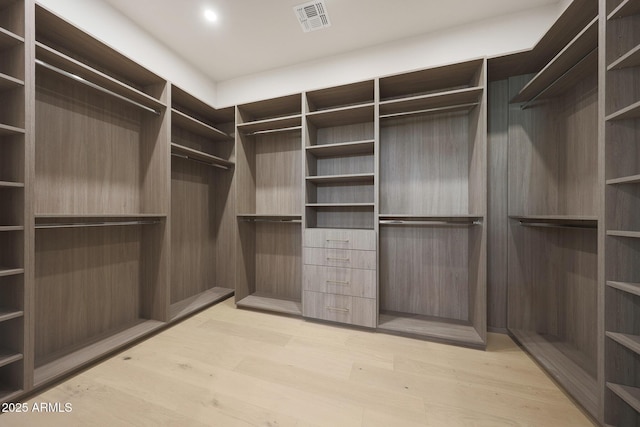 6126 E Charter Oak Rd, Scottsdale, AZ 85254 - walk in closet with light wood finished floors