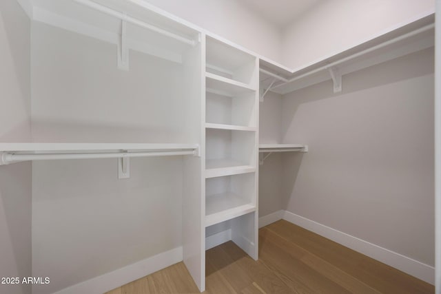 6126 E Charter Oak Rd, Scottsdale, AZ 85254 - walk in closet with wood finished floors