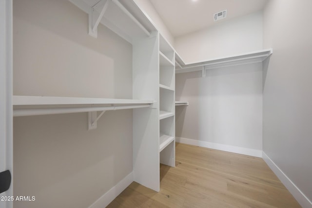 6126 E Charter Oak Rd, Scottsdale, AZ 85254 - walk in closet featuring light wood-style floors