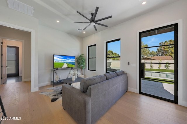 6126 E Charter Oak Rd, Scottsdale, AZ 85254 - living area featuring light wood-style flooring, ceiling fan, and recessed lighting