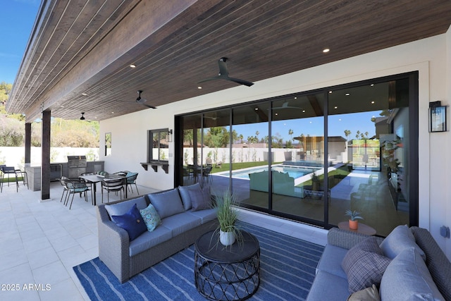 6126 E Charter Oak Rd, Scottsdale, AZ 85254 - view of patio featuring exterior kitchen, outdoor lounge area, ceiling fan, and outdoor dining space
