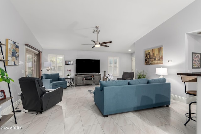 living room featuring ceiling fan and vaulted ceiling