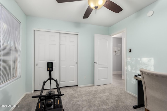 office with ceiling fan and light colored carpet