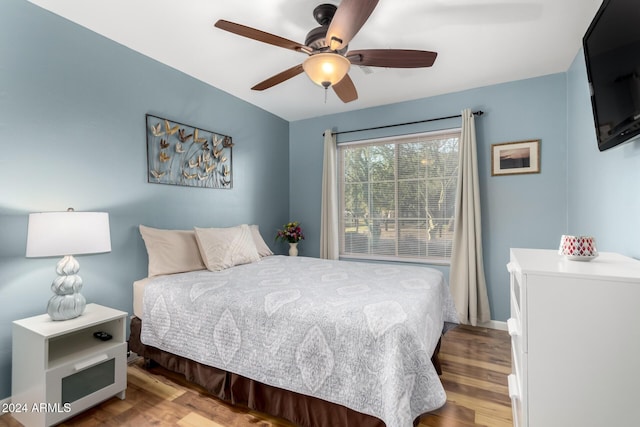 bedroom featuring hardwood / wood-style floors and ceiling fan