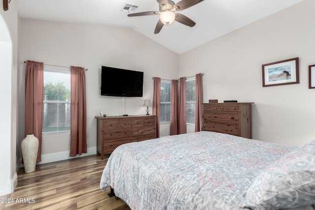 bedroom featuring hardwood / wood-style floors, ceiling fan, and lofted ceiling