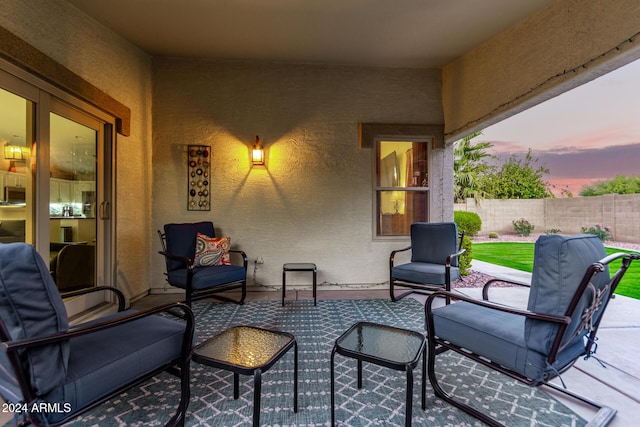 view of patio terrace at dusk