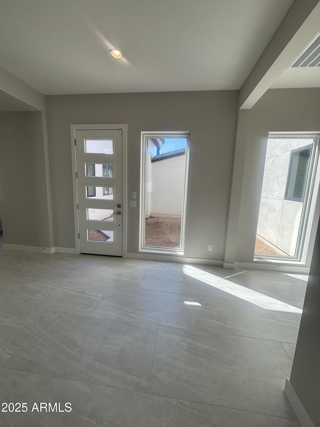 interior space featuring a wealth of natural light, recessed lighting, and baseboards