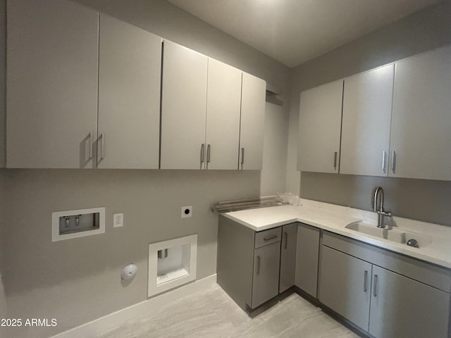 laundry room featuring gas dryer hookup, washer hookup, cabinet space, hookup for an electric dryer, and a sink