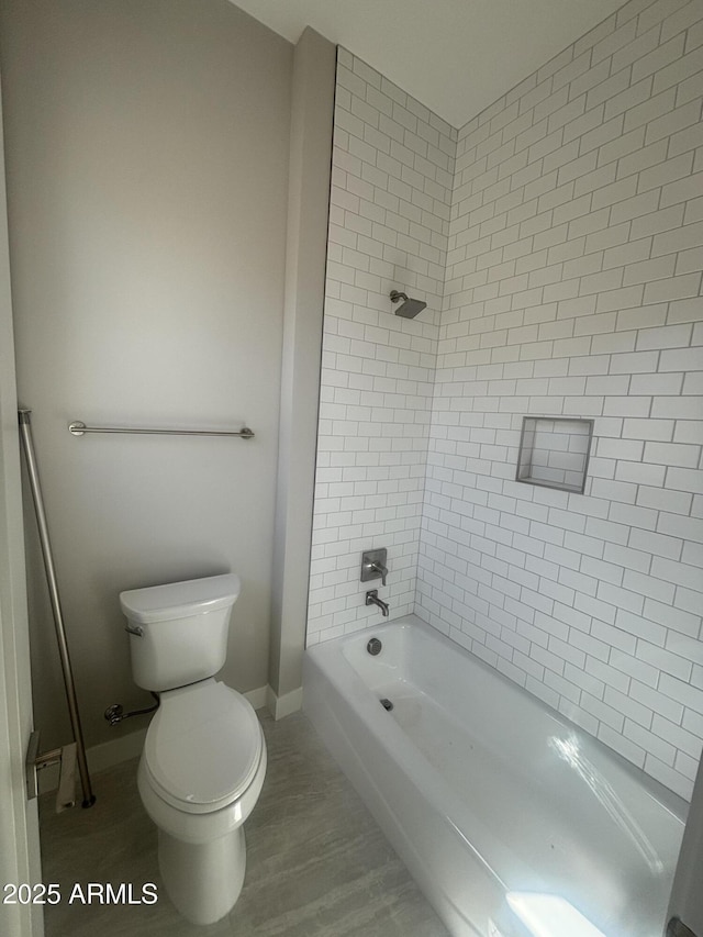 full bath with baseboards, toilet, shower / washtub combination, and wood finished floors