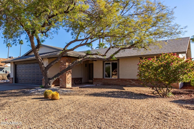 ranch-style home featuring a garage