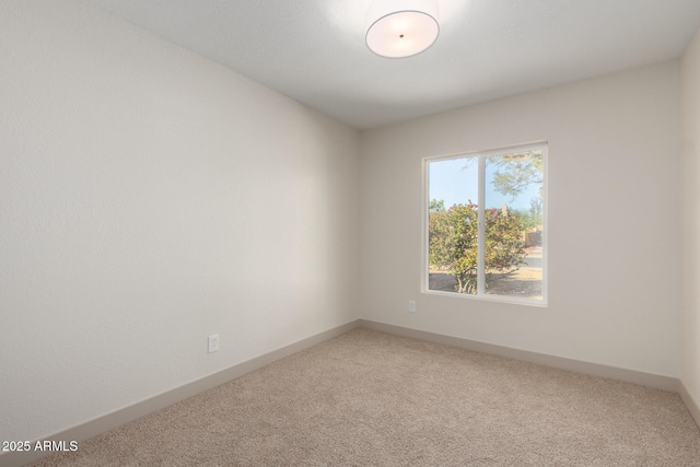 spare room featuring carpet