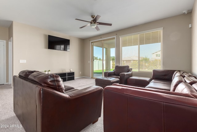 carpeted living room featuring ceiling fan