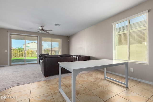 tiled living room featuring ceiling fan