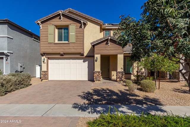 view of front of property featuring a garage