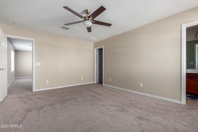 empty room with light colored carpet and ceiling fan