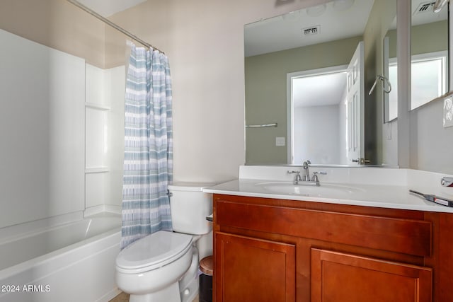 full bathroom featuring toilet, vanity, and shower / bath combination with curtain