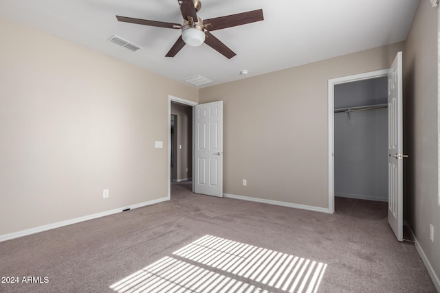 unfurnished bedroom featuring a closet, ceiling fan, and light carpet