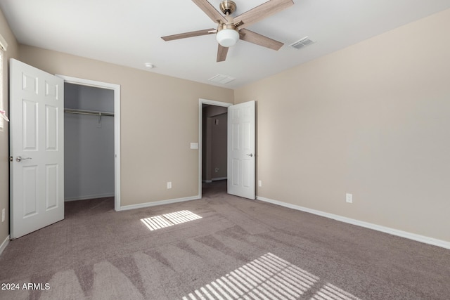 unfurnished bedroom featuring a closet, ceiling fan, and light carpet