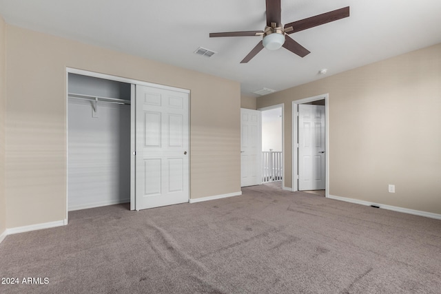 unfurnished bedroom with carpet floors, a closet, and ceiling fan