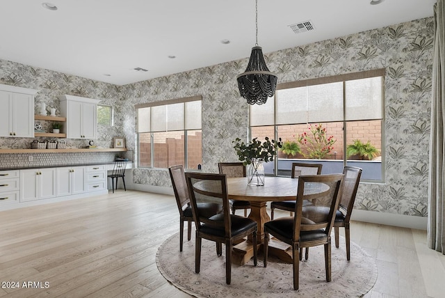 dining area with light hardwood / wood-style floors