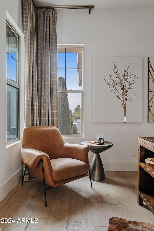 sitting room with hardwood / wood-style floors