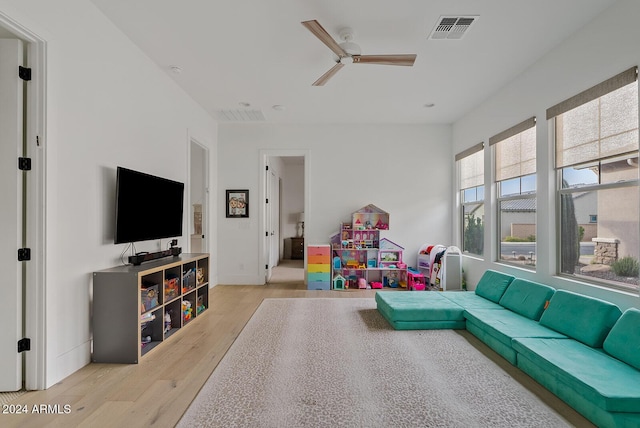 rec room featuring ceiling fan and light hardwood / wood-style floors