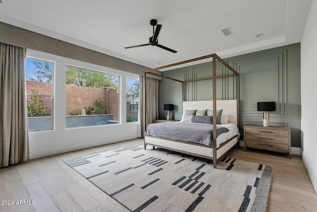 bedroom with ceiling fan and light wood-type flooring