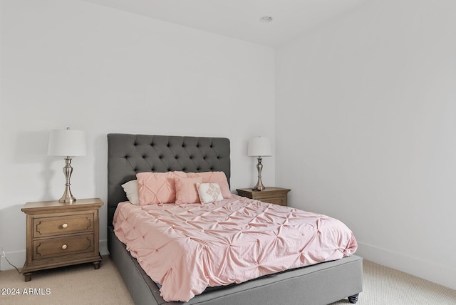 bedroom with light colored carpet