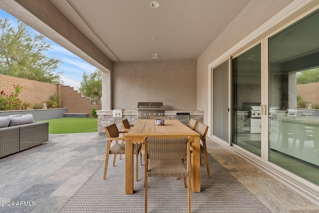 view of patio / terrace with an outdoor kitchen and area for grilling